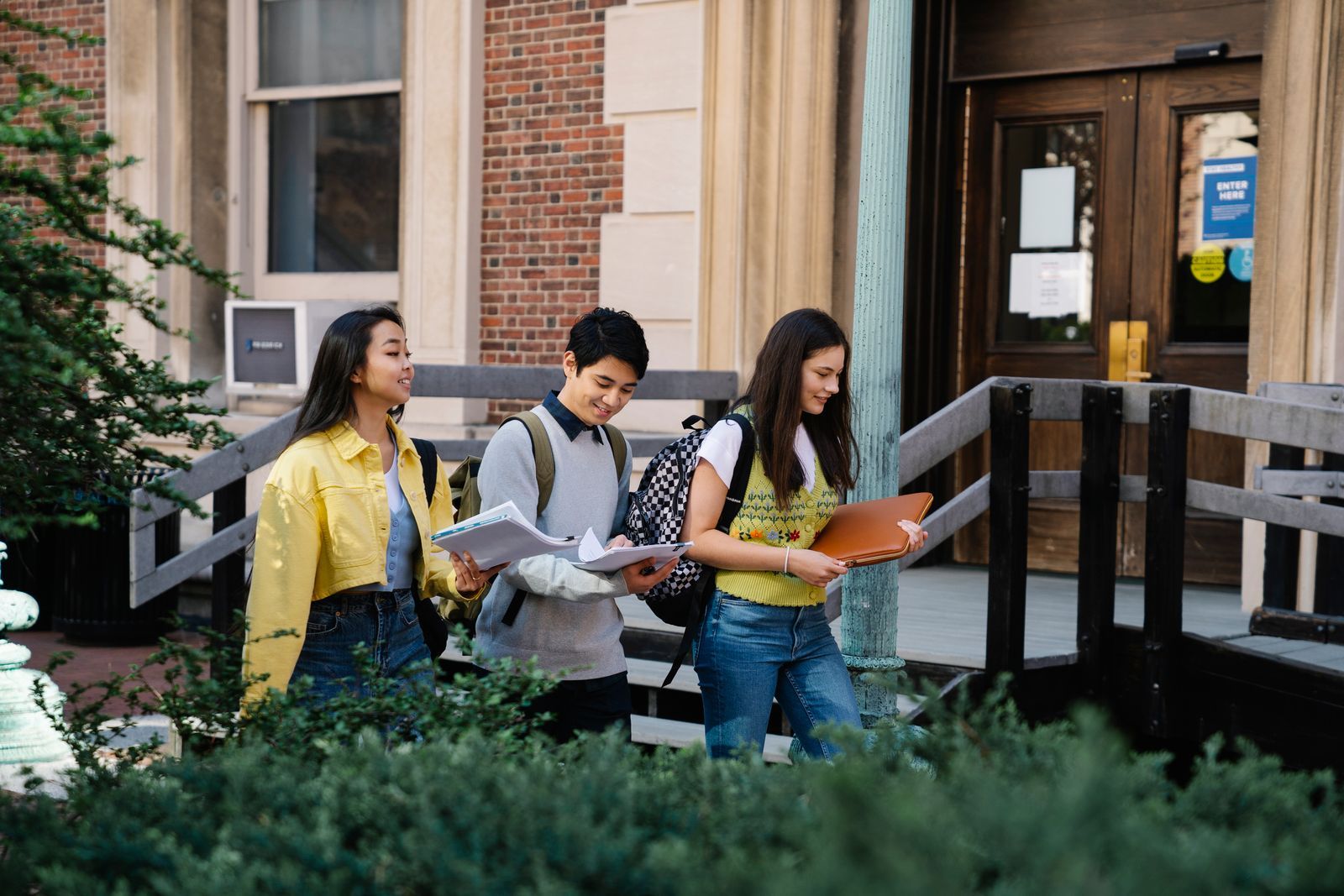 Students walking across a university campus